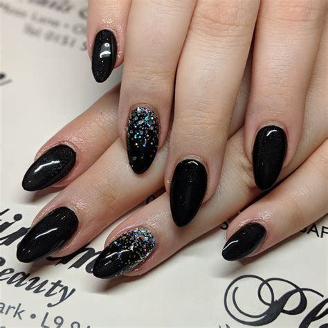 Glittery Glam. . Acrylic black nails with glitter
